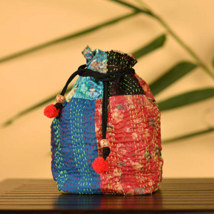 Colourful Potli in traditional Kantha patchwork on silk exteriors