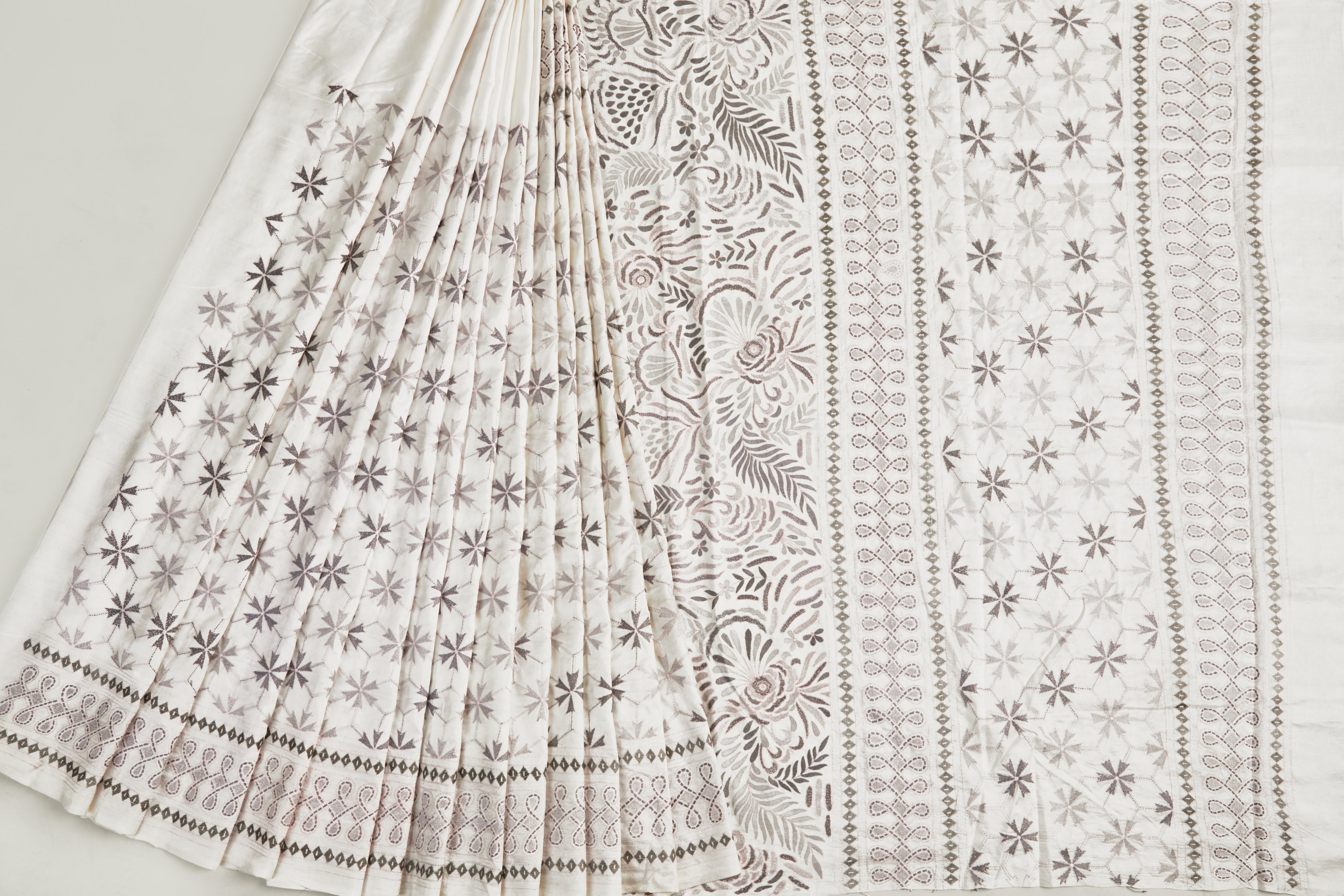 Soft White Bangalore Silk Saree in grey shades of nature-inspired motifs